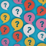 Repeating pattern of question marks in colorful speech bubbles