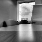 Black and white photo of an empty conference room